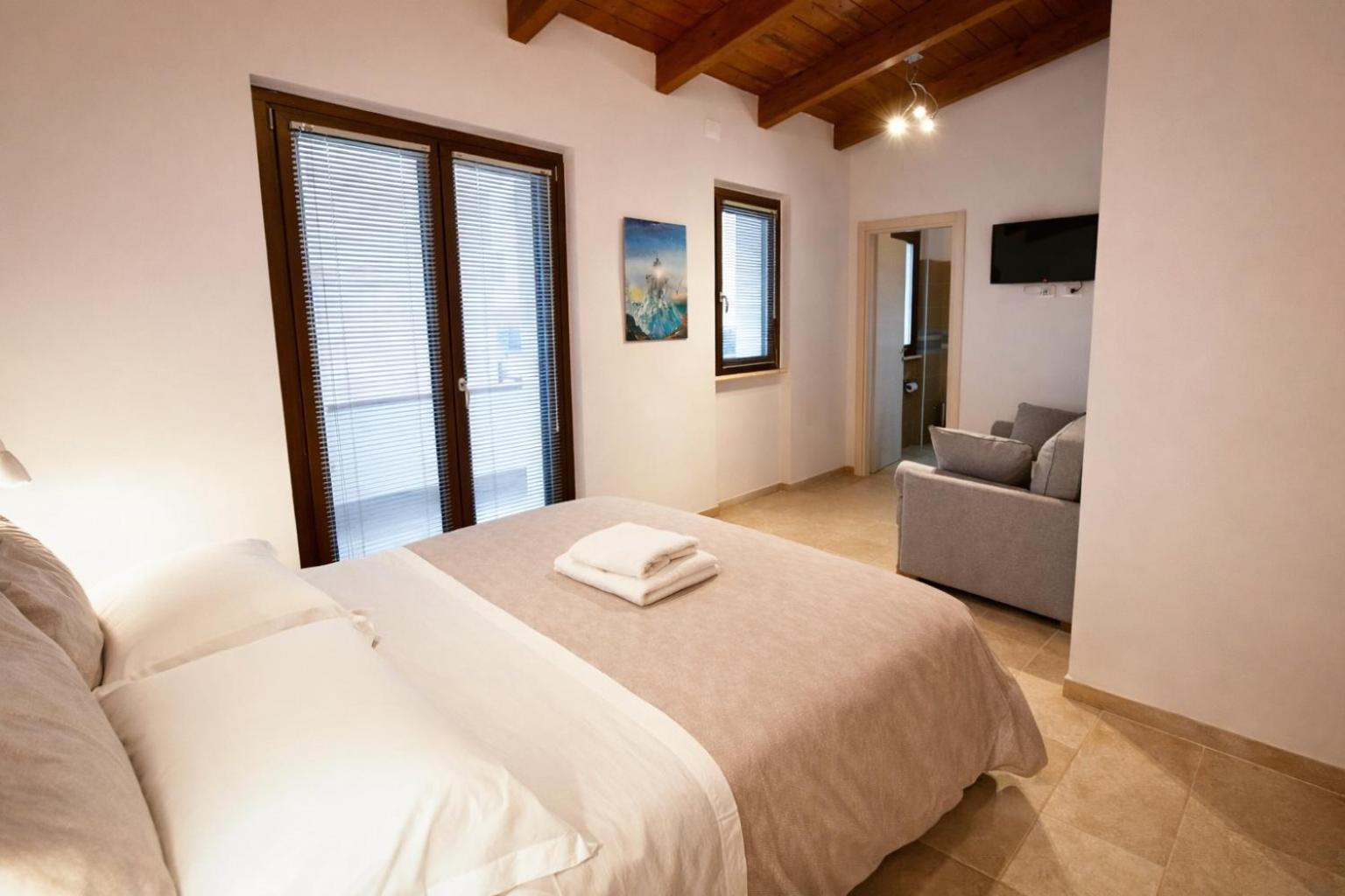 Camera Matrimoniale con Letto Supplementare